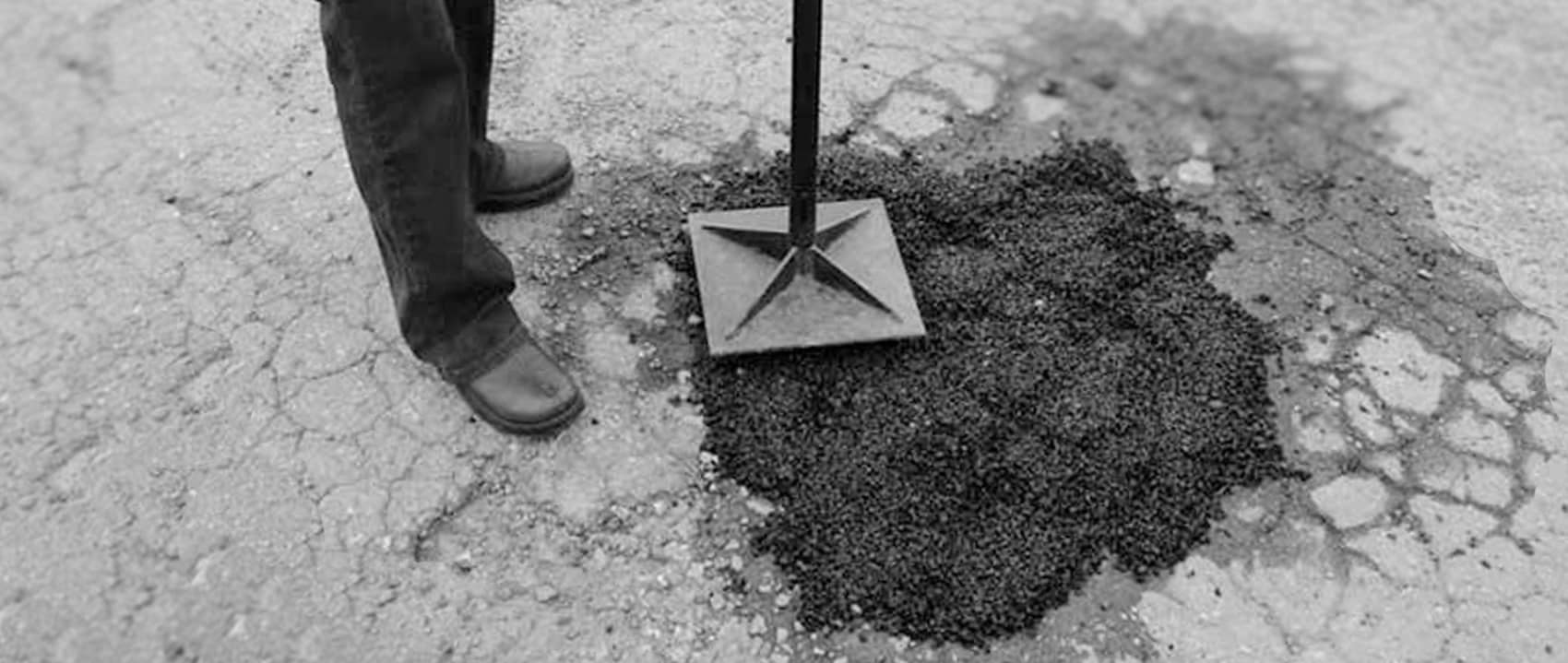 Tamping an EZ Street pothole patch